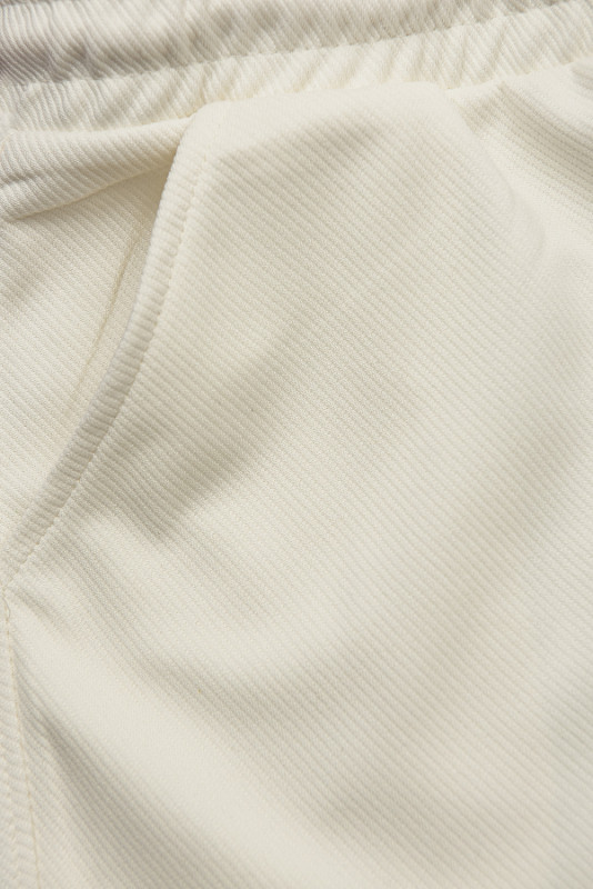 Ecru športové nohavice s vreckami