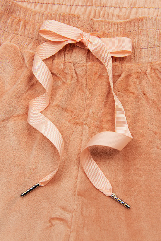 Marhuľové zamatové teplákové nohavice